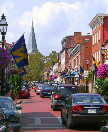 Americans sure do love their cars.  They are determined to cram their SUVs down street designed for horses and buggies!